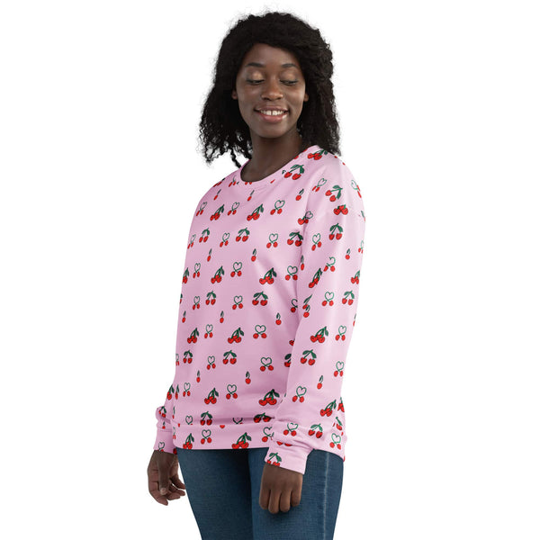 Black woman wearing a pink sweatshirt with red cherries, made from recycled polyester, side view, showcasing eco-friendly style.