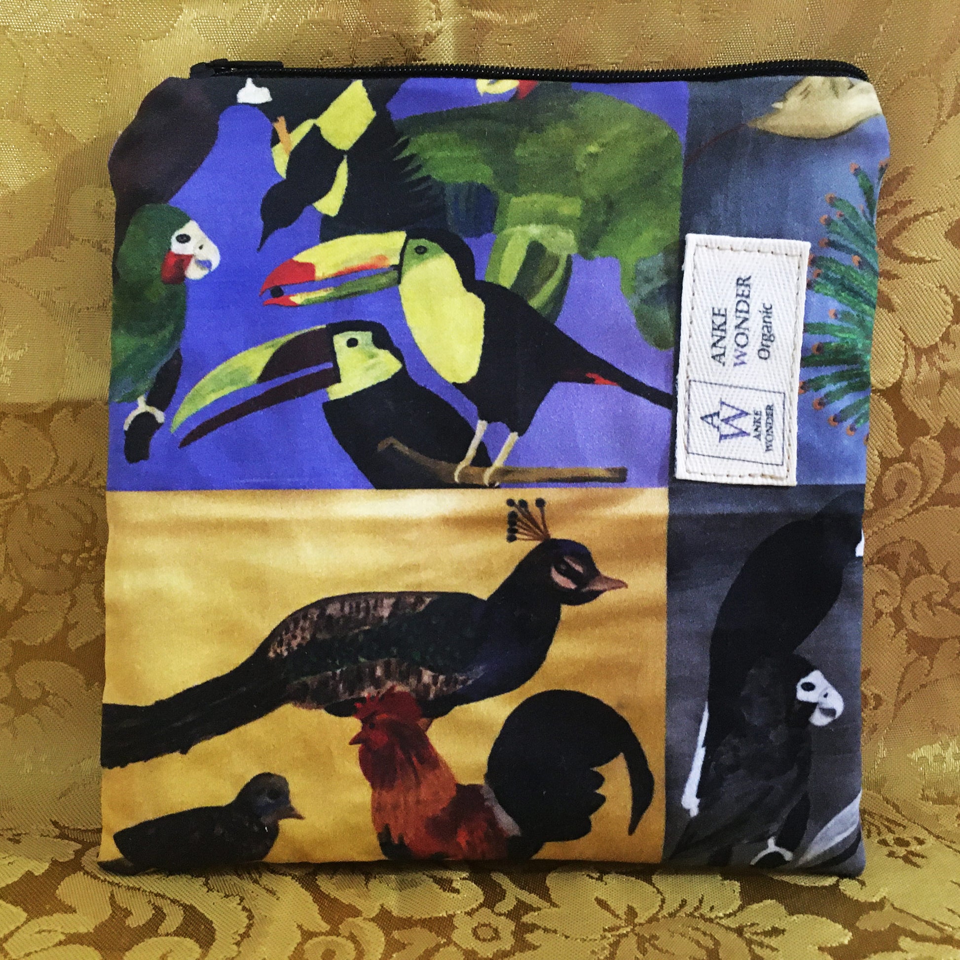 Fabric pouch with bird designs on a floral background