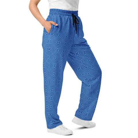 Close-up front view of women's wide-leg joggers showcasing the geometric blue print, elastic waistband, and black drawstring.