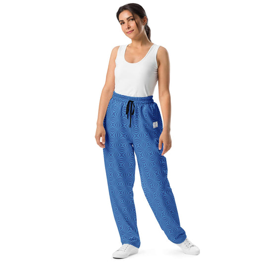 Blue wide-leg joggers with a geometric pattern shown in a front view - designed by Anke Wonder.