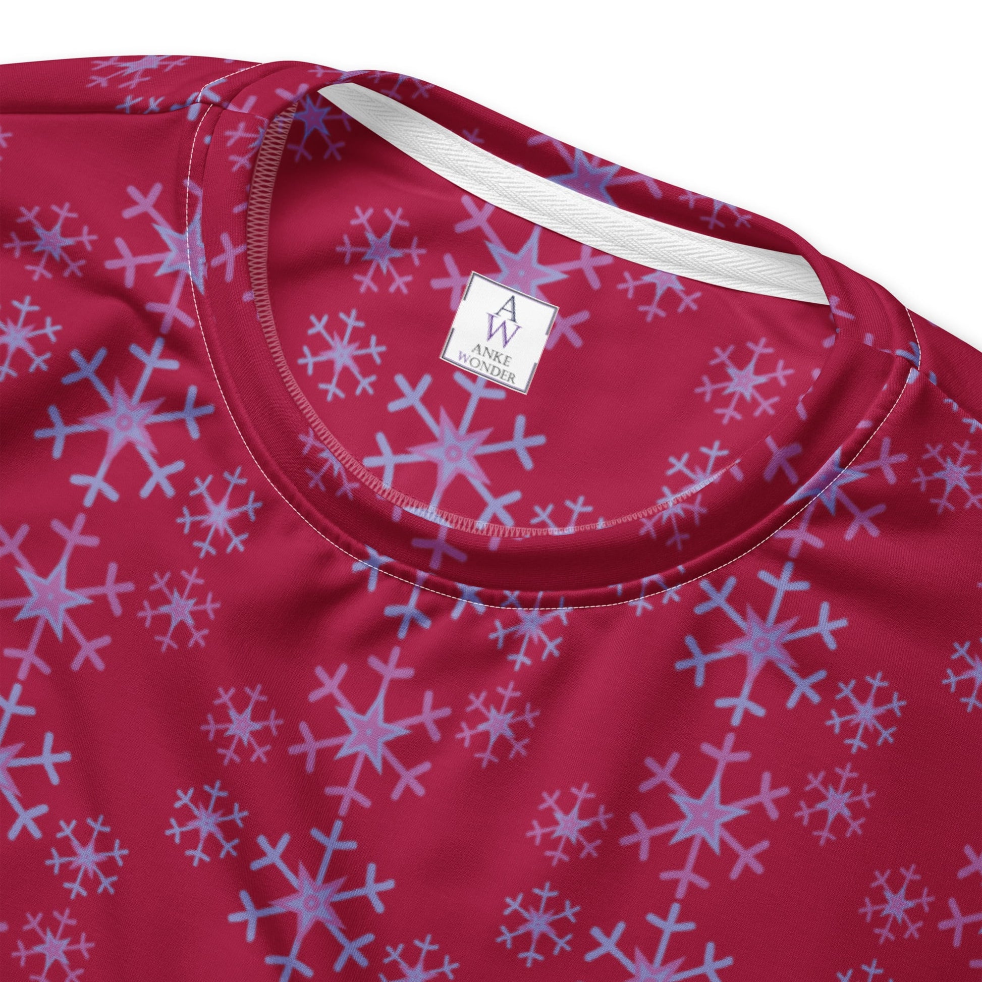 Detailed close-up of the inside Anke Wonder label of the Festive Snowflake Women's Sweatshirt.