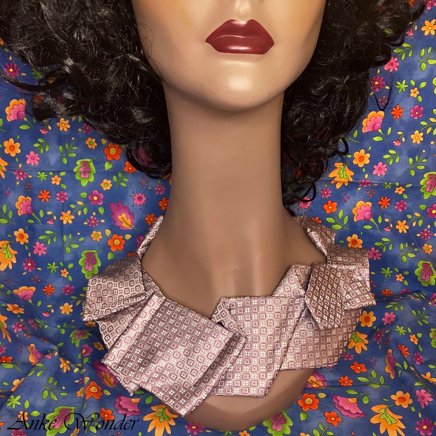 Mannequin Wearing Handmade Pink Silk Necktie with Geometric Design – Front View Close-up of Geometric Floral Pattern
