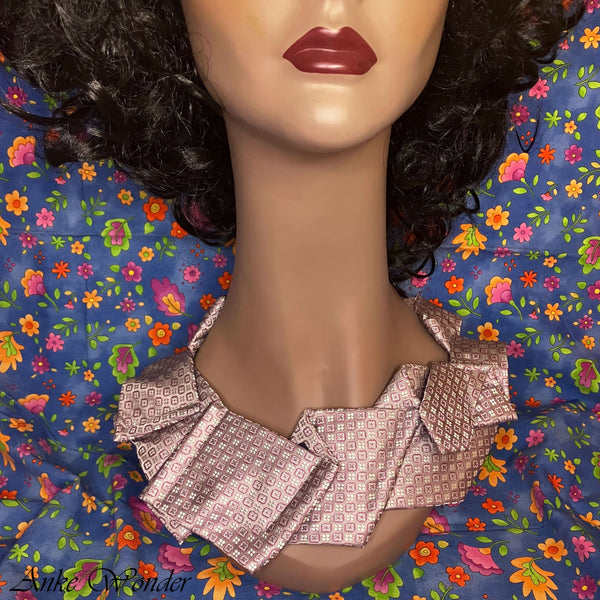 Mannequin Wearing Handmade Pink Silk Necktie with Geometric Design – Front View Close-up of Geometric Floral Pattern