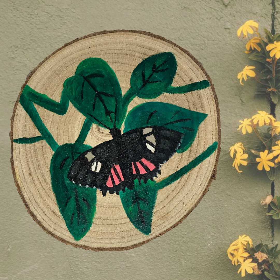 Hand-painted wooden slice featuring a vibrant red postman butterfly against a green wall. The rustic wooden art piece showcases intricate details of the butterfly, highlighting its natural charm.