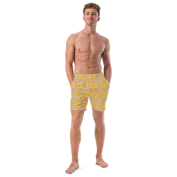 A front view of a model wearing the honeycomb bee swim trunks, highlighting the elastic waistband and quick-drying material.