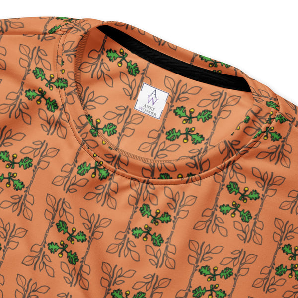 Close-up of the Acorn and Oak Vine Womens Sweatshirt showcasing an orange terracotta background with a cascading pattern of green oak leaves and acorns, featuring a soft, brushed fleece interior.