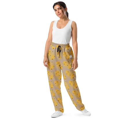 Woman wearing yellow bee print joggers based on handpainted artwork by Anke Wonder.