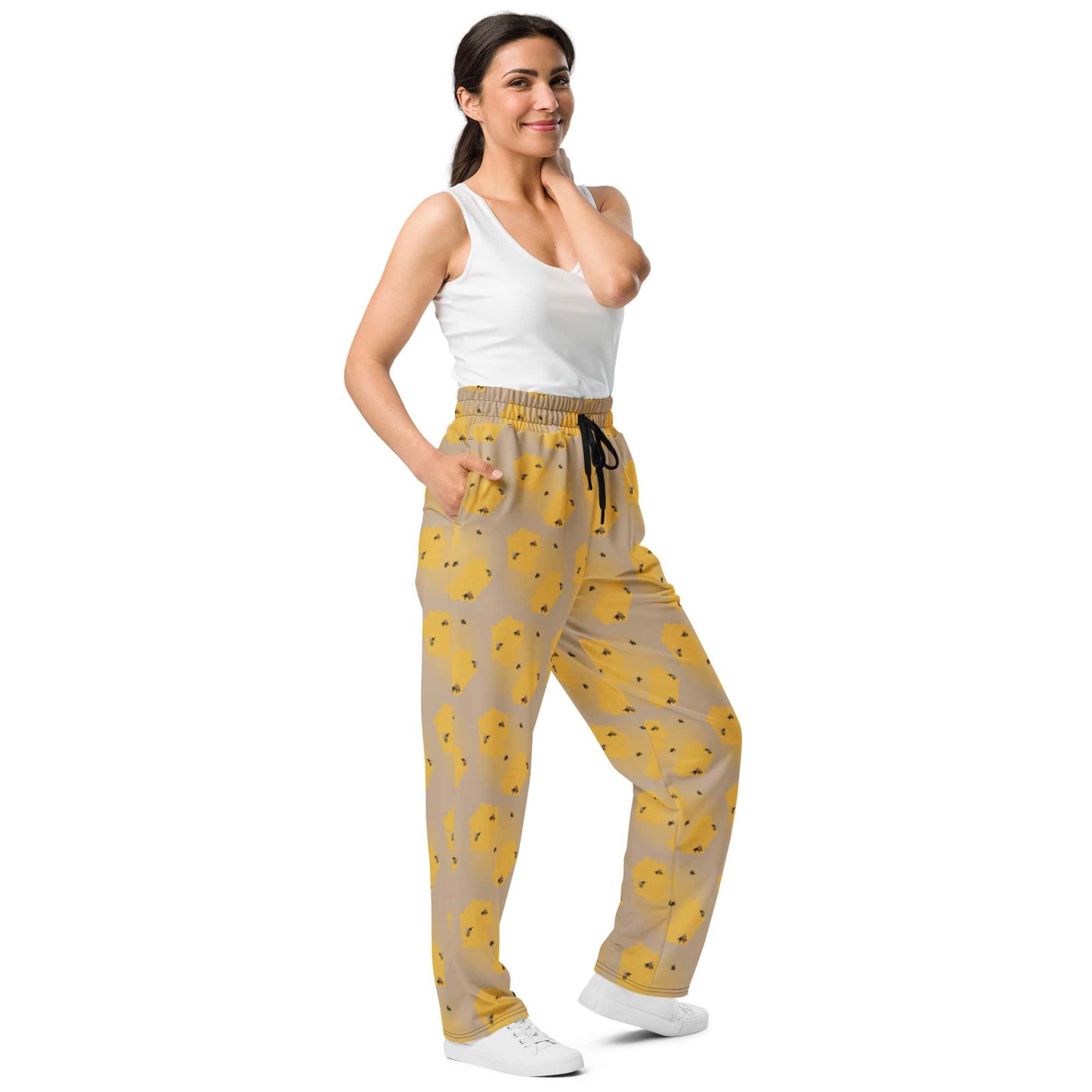 Side view of women’s joggers showing bee pattern and side pocket detail.