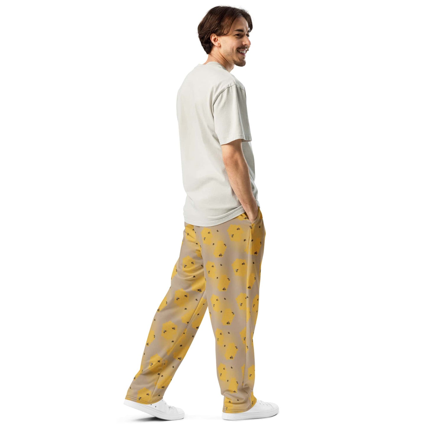 Back view of men’s joggers with nature-inspired bee print on sustainable fabric.