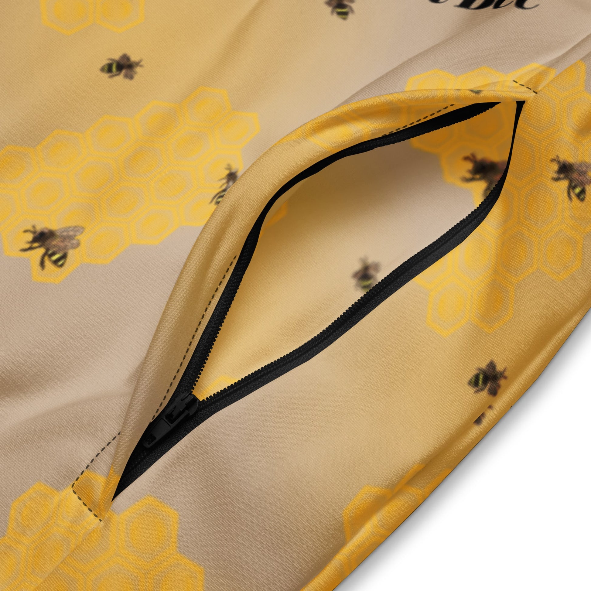 Detail of zippered side pocket on motivational bee jacket made from recycled polyester.
