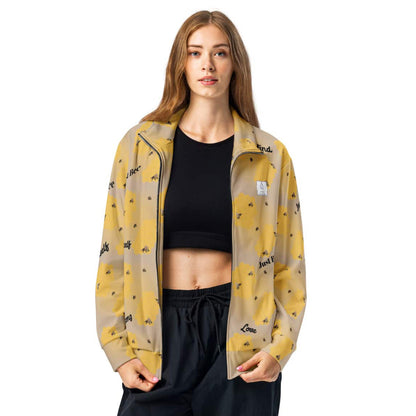 Women’s bee-themed track jacket with honeycomb and positive words like “Just Bee,” “Kind,” and “Strong” on recycled fabric.