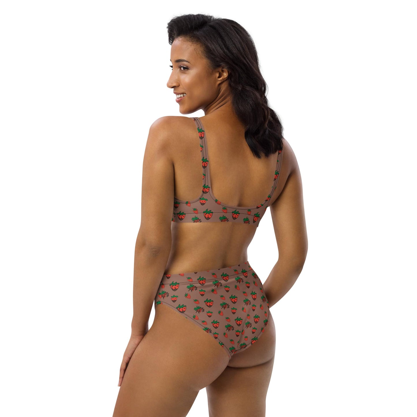 Back view of woman wearing eco-friendly strawberry print high-waisted bikini, turned slightly to the right, highlighting the flattering side cut and soft texture.