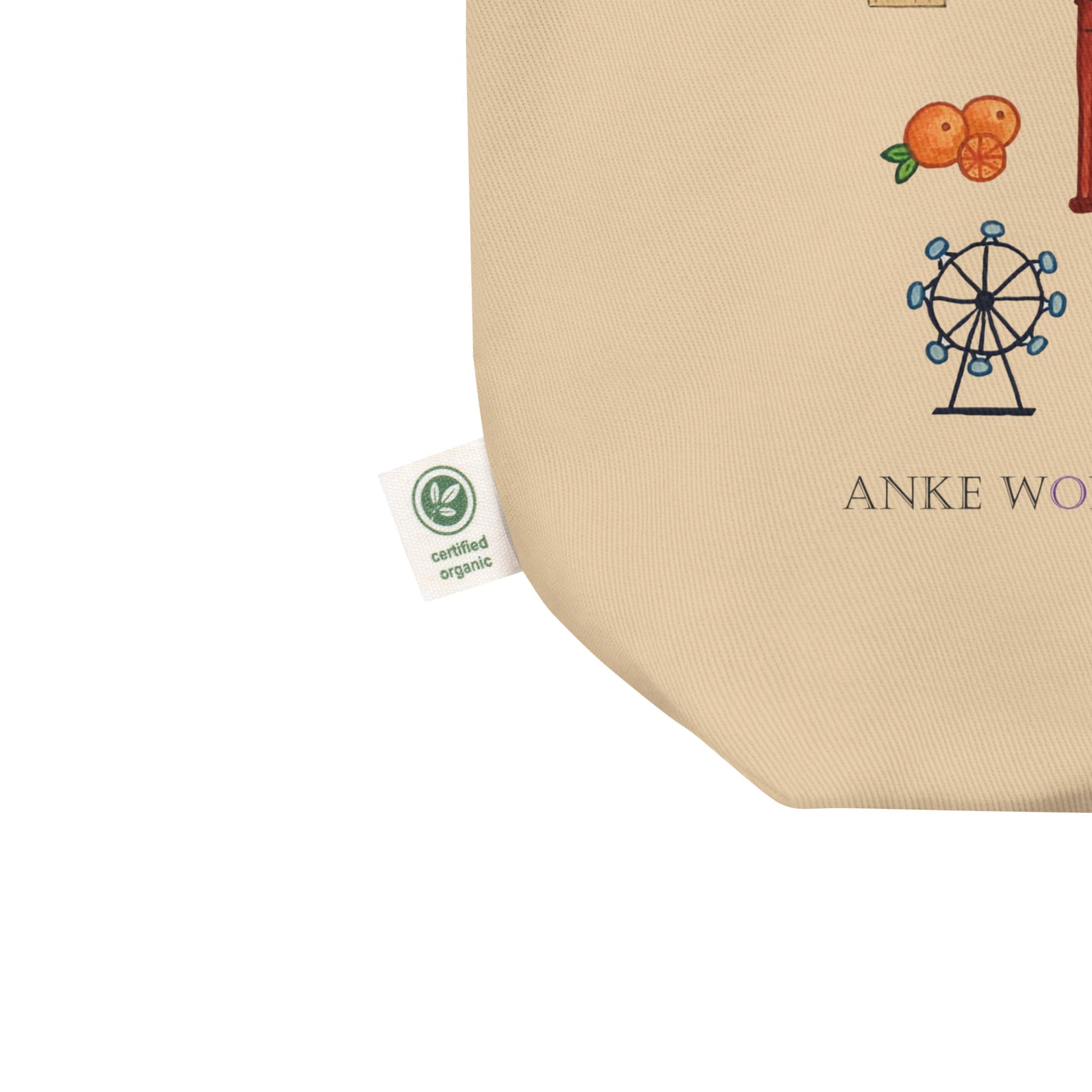 Close-up of illustrated London-themed print on organic cotton tote with certified label.