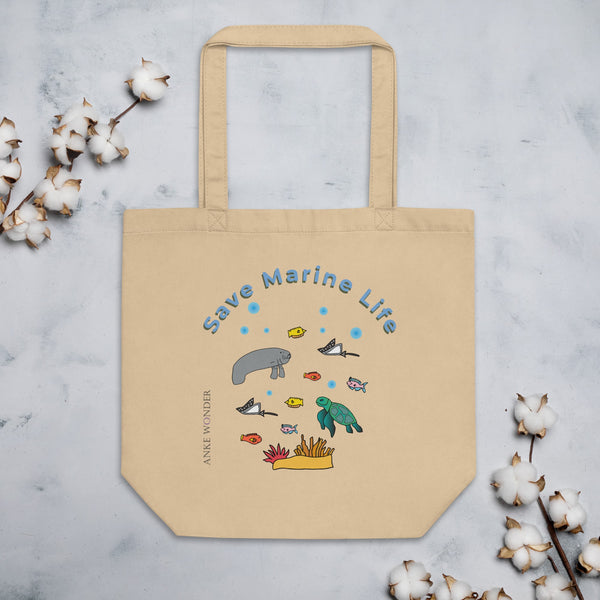 A beige organic cotton tote bag featuring an ocean-inspired design with a manatee, sea turtle, stingrays, colorful fish, coral, and the words "Save Marine Life."