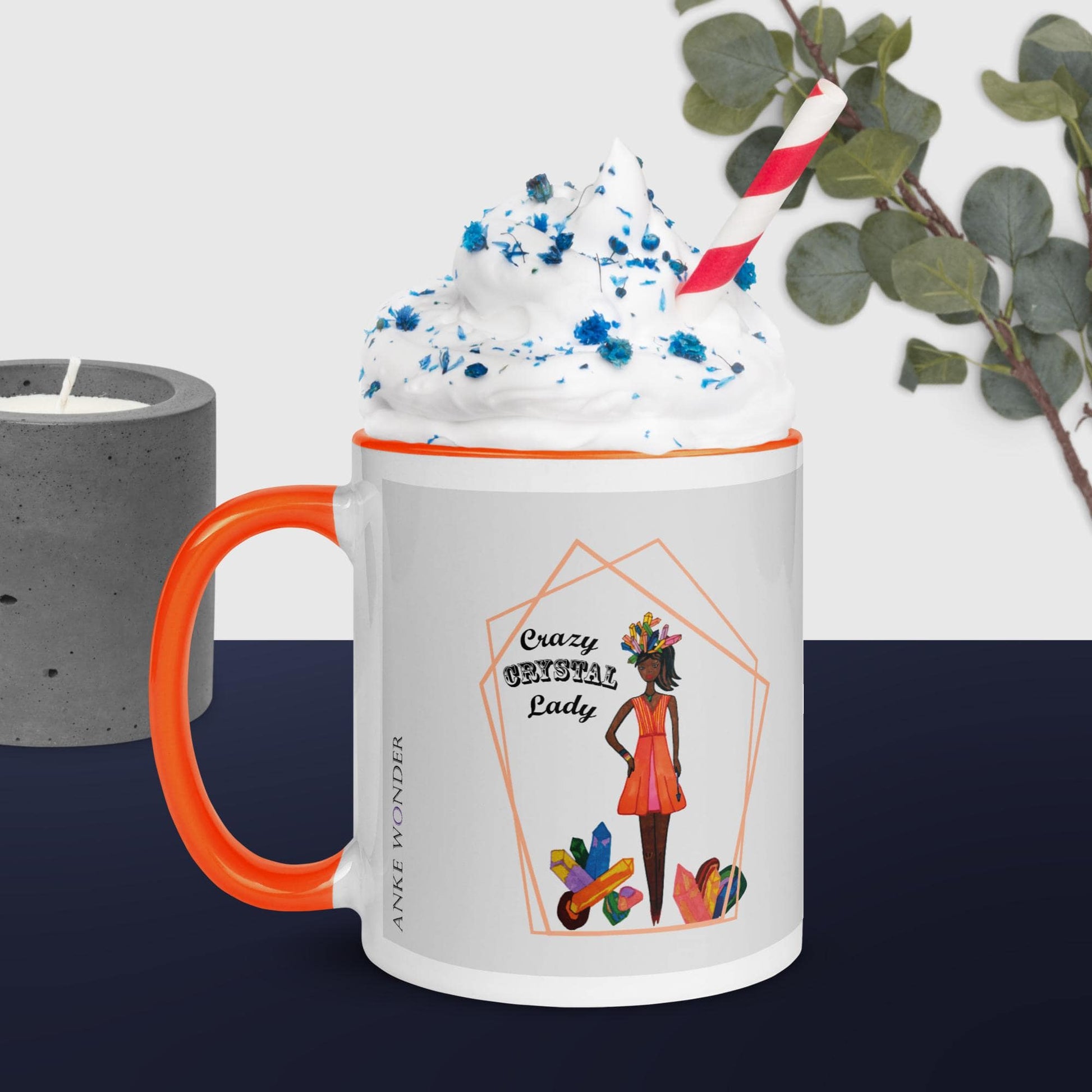 White mug with orange handle featuring a design of a black woman and 'Crazy Crystal Lady' text, filled with a colorful drink.