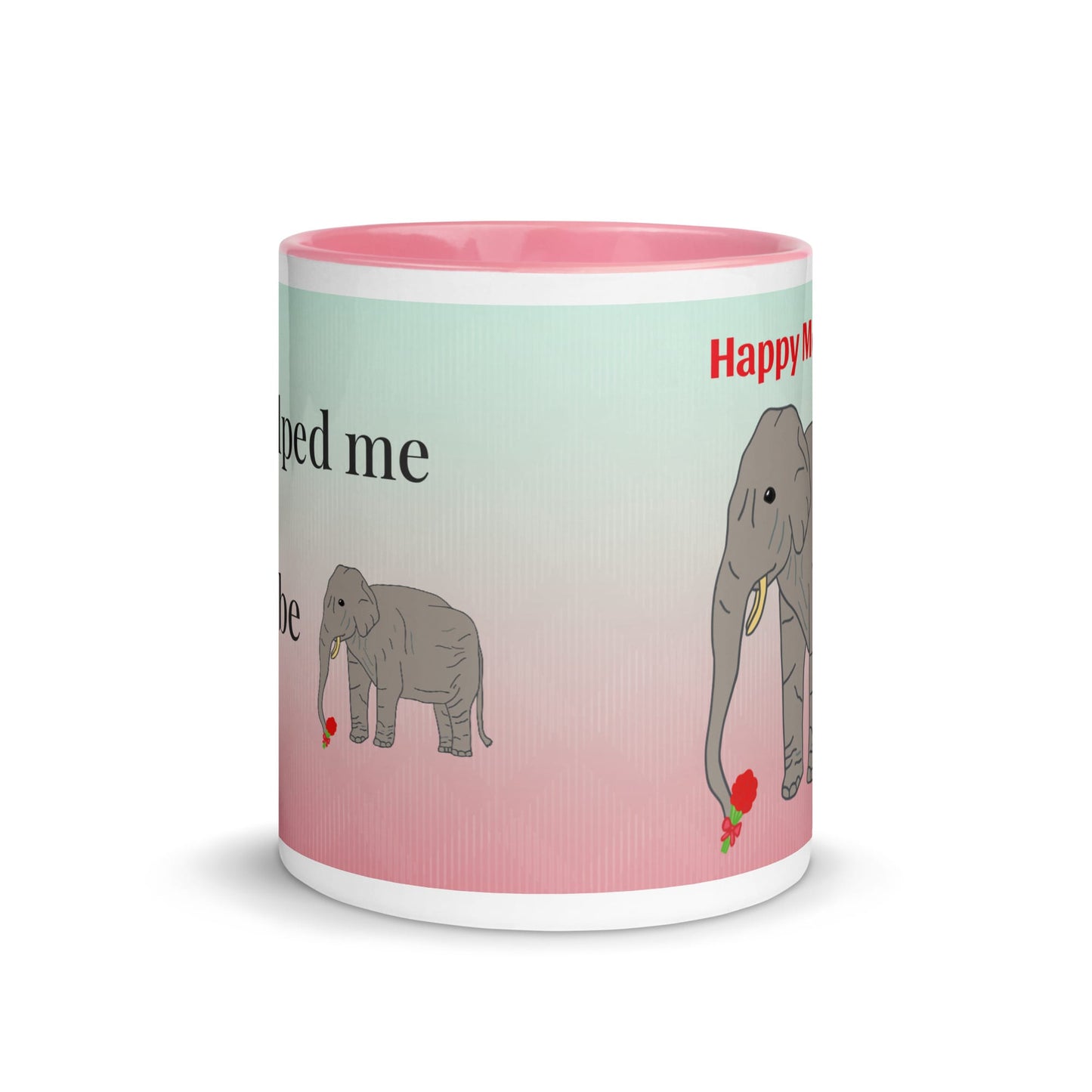 A pink-handled ceramic mug with a light green and pink gradient background, featuring the text “You helped me grow and to be strong” alongside a drawing of an elephant holding a red flower. The mug is held by a person in a white long-sleeve shirt.