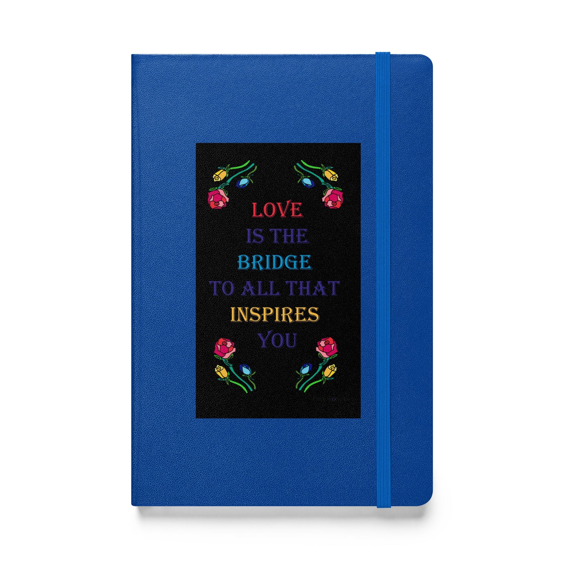Front of hardcover notebook with blue binding featuring the quote "Love is the bridge to all that inspires you" in colorful text with roses designed by Anke Wonder.