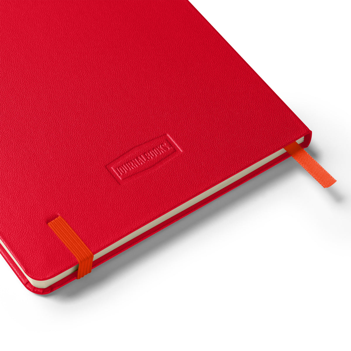 Backside of red notebook with orange binding on a white background