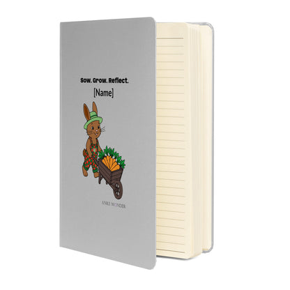 Notebook with a rabbit illustration and text 'Sow.Grow.Reflect.' on the cover, featuring the brand 'Anke Wunder'.
