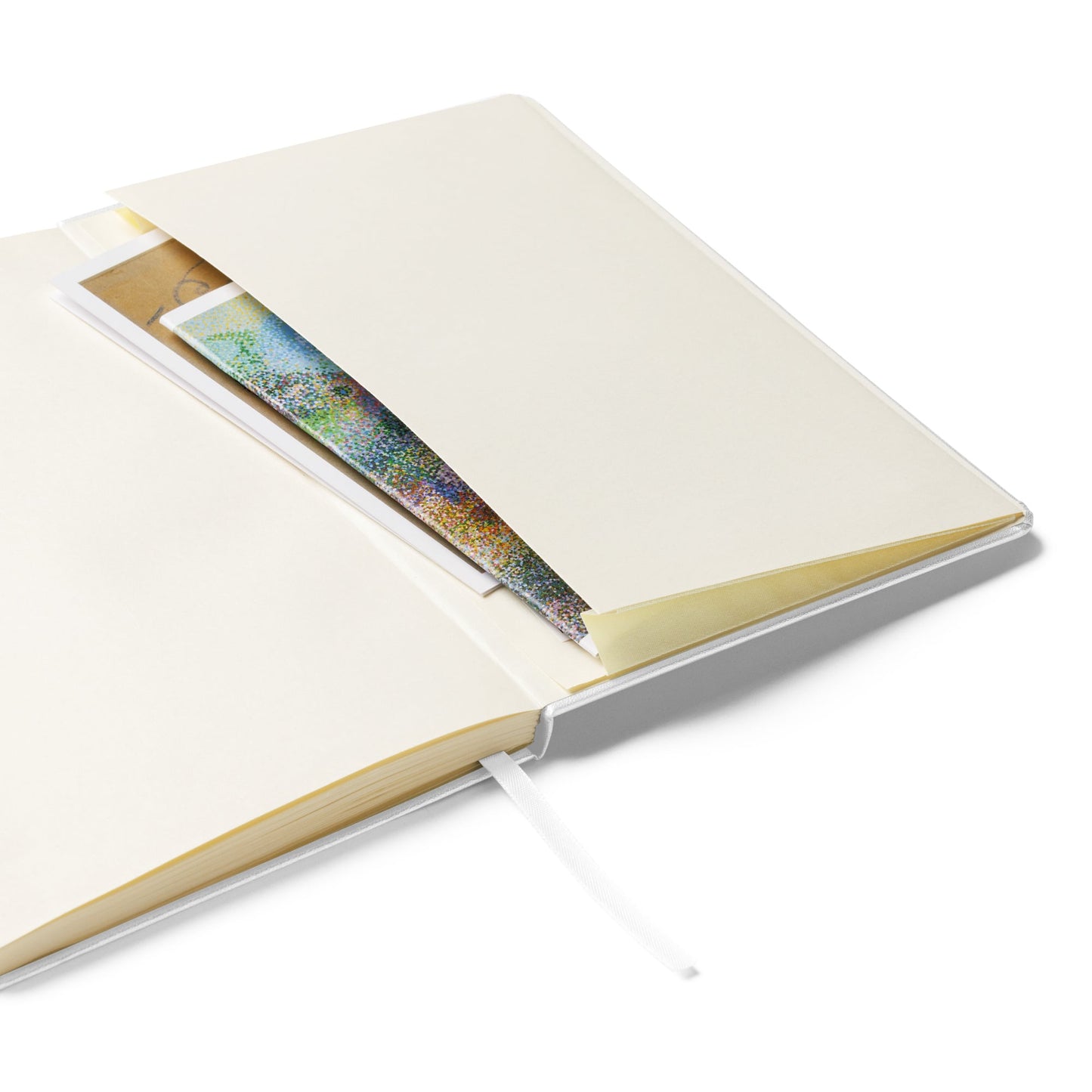 White notebook with a pouch inside on a white background by Amle Wonder.