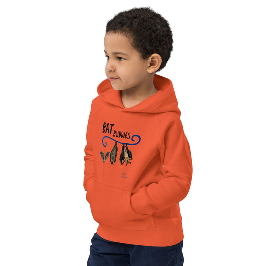 Boy wearing an orange hoodie with a Halloween graphic design on a white background