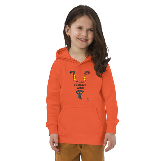 Young girl wearing an orange hoodie with a Halloween design on a white background
