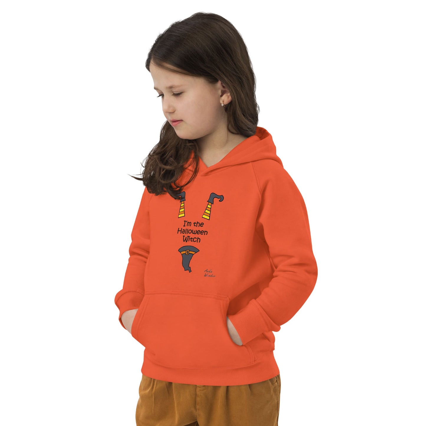 Side view of child wearing an orange hoodie with a Halloween design and the text 'I'm the Halloween witch' on a white background