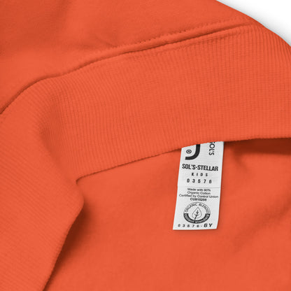 Close-up of an orange kids hoodie with a organic cotton label on a white background