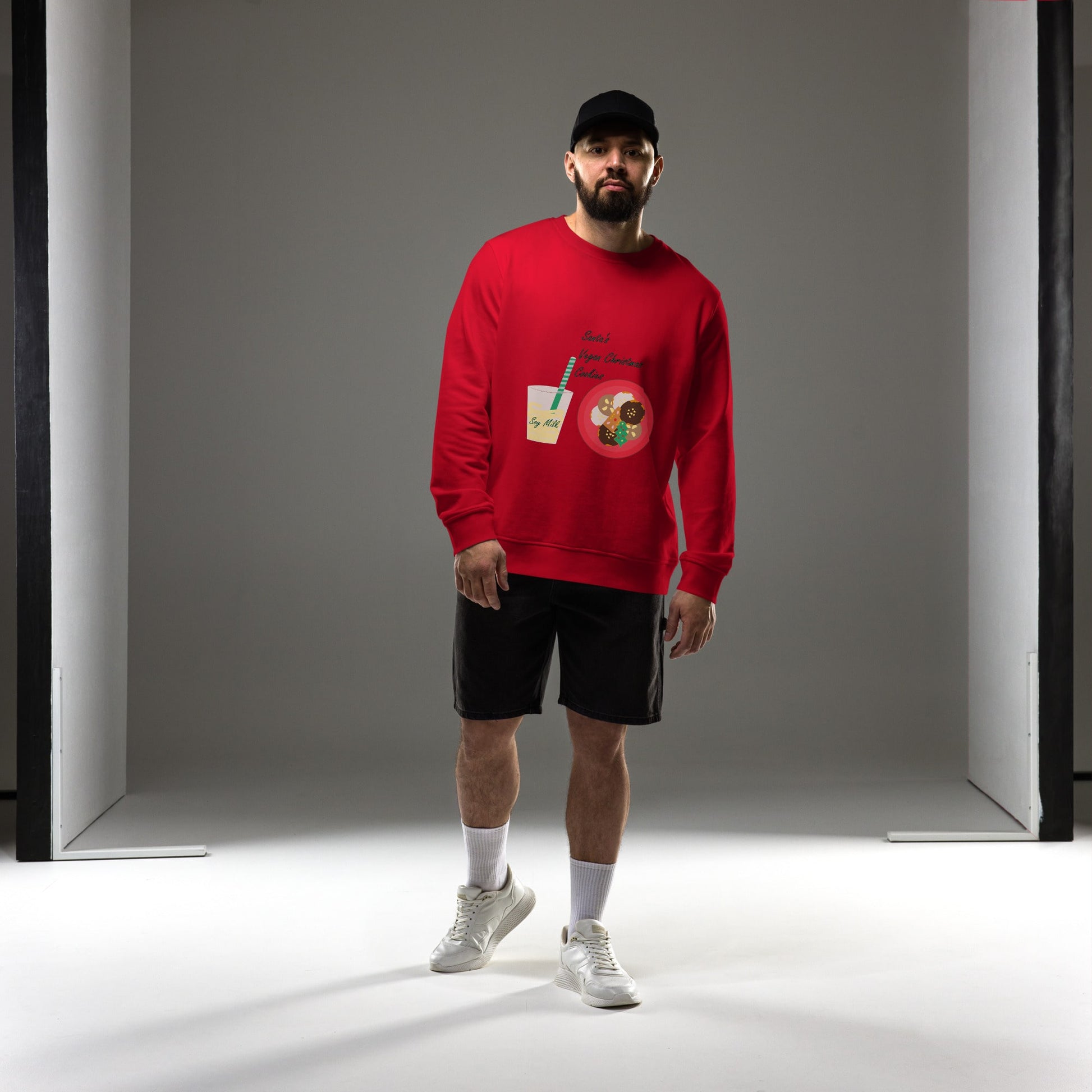 Men wearing an organic cotton Christmas sweatshirt in red, showcasing the cozy fit and holiday design, saying 'Santa's Vegan Christmas Cookies".