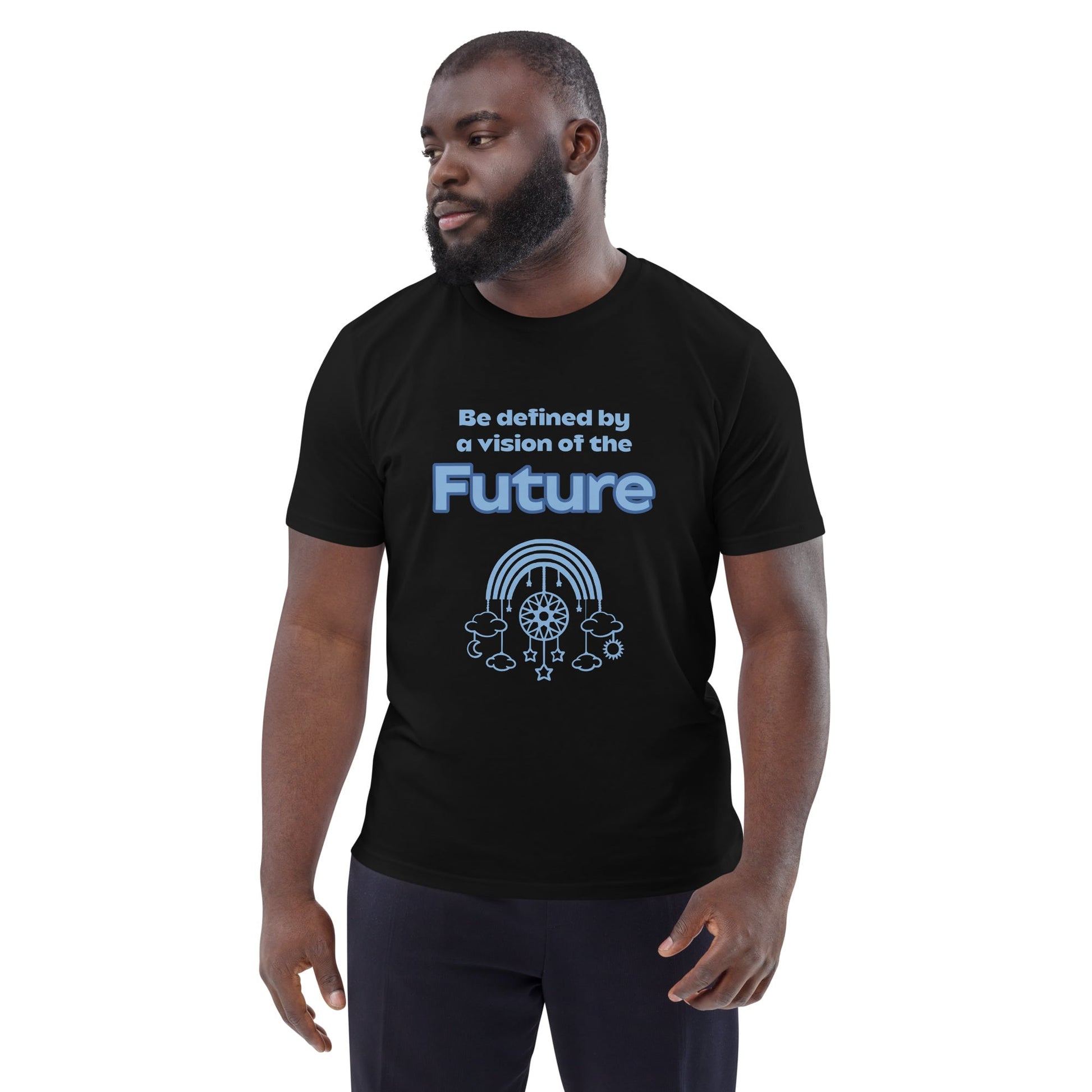 Black Man wearing an organic cotton t-shirt in black with the quote “Be defined by a vision of the Future” and a futuristic graphic of clouds, rainbow, stars, and gears.