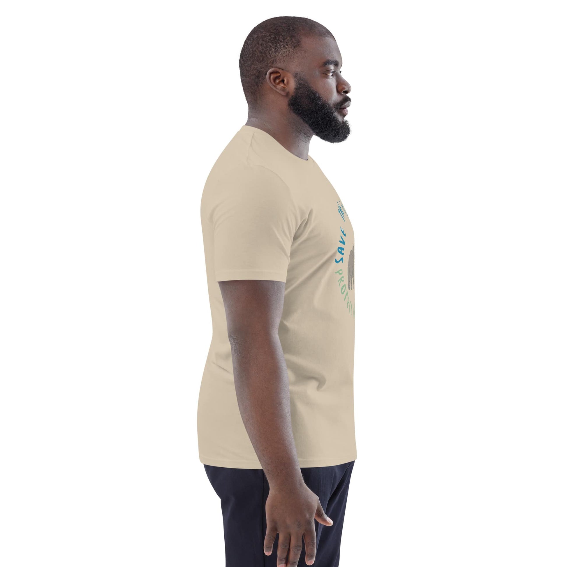 Side profile of a man in a desert dust organic cotton “Save the Elephants – Protect Not Poach” t-shirt; the side view emphasizes fit and comfort.