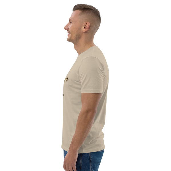 Side view of man wearing a beige t-shirt with bee design on a white background