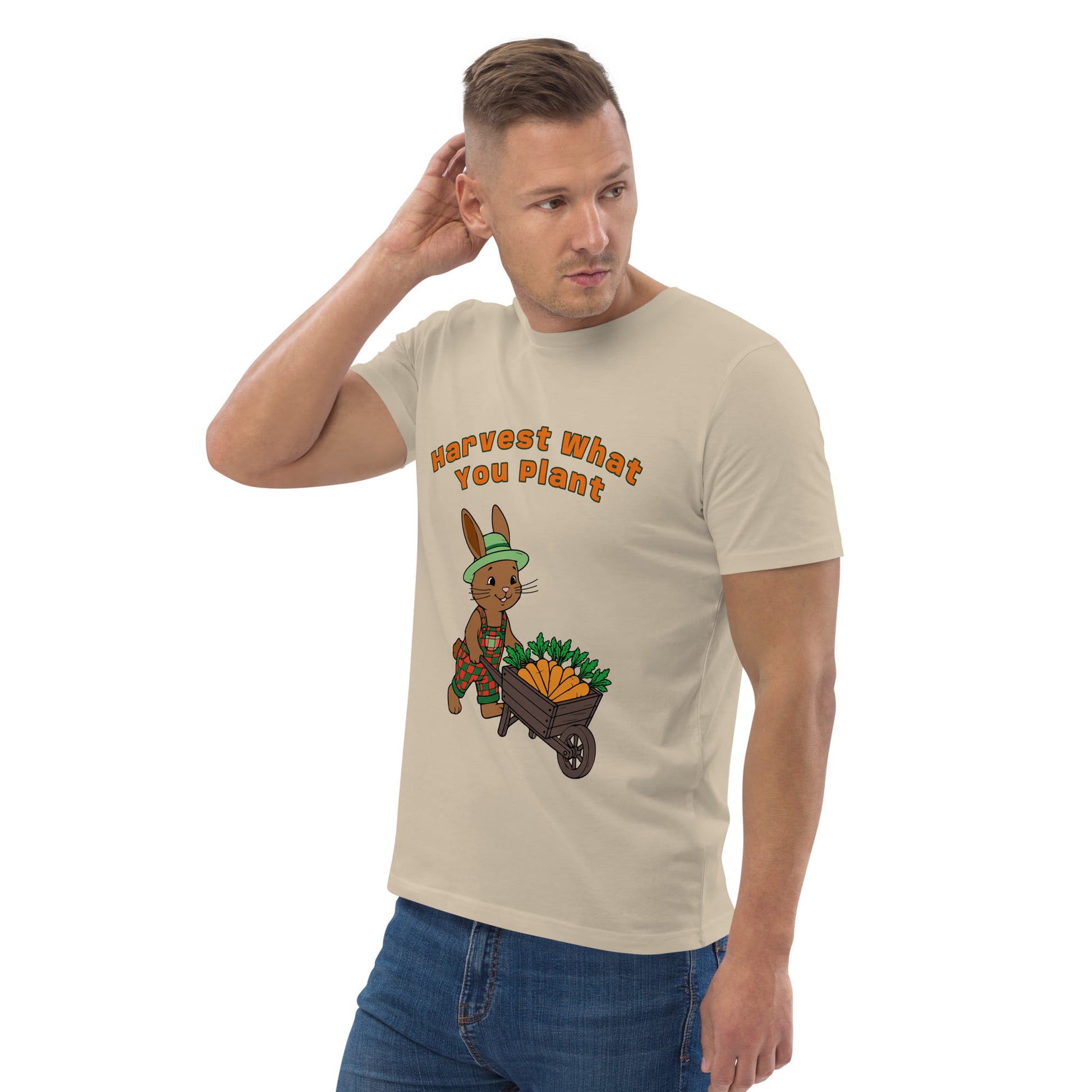 Man wearing a beige t-shirt with a cartoon rabbit and text design on a white background