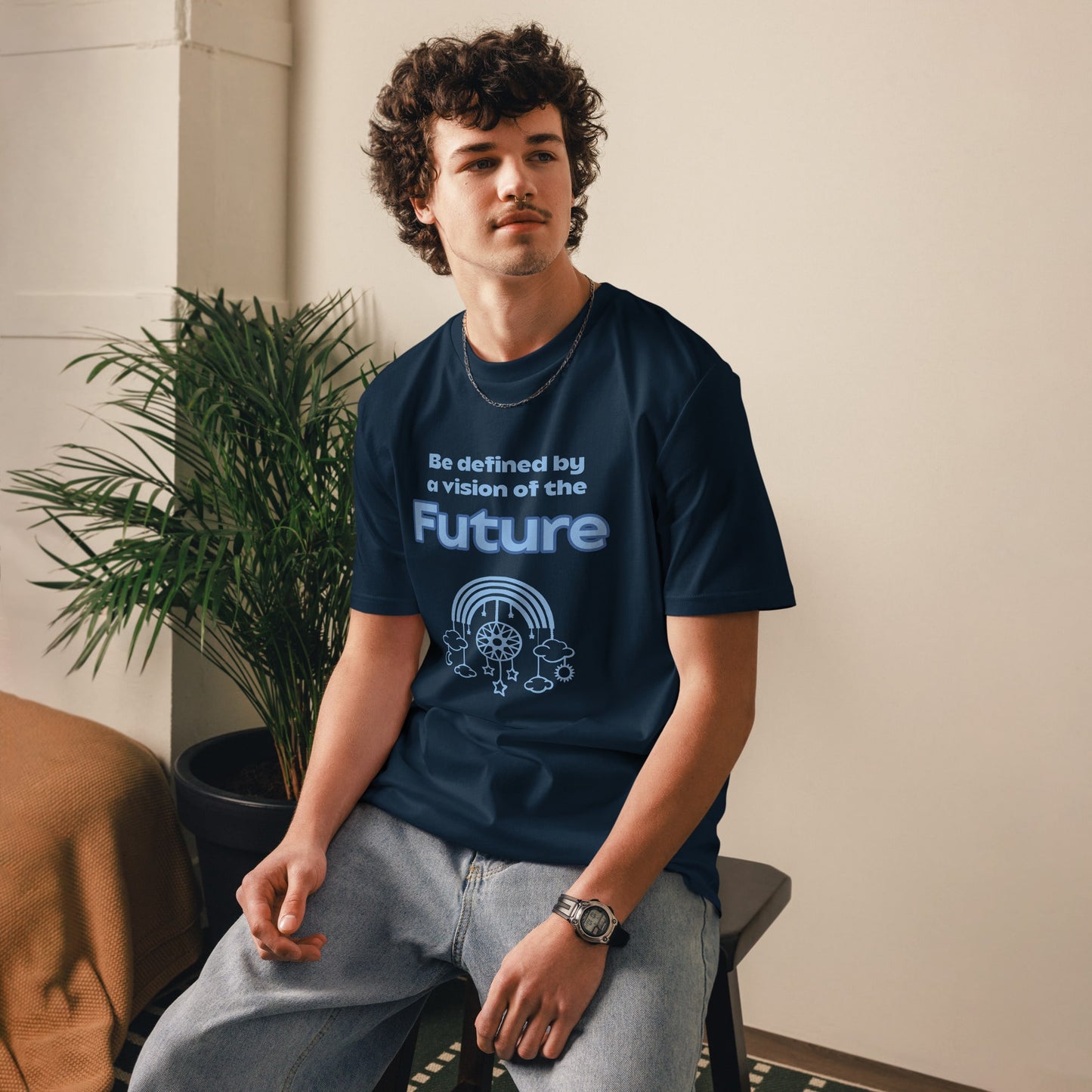 Angled front view of the men's t-shirt in navy featuring the “Be defined by a vision of the Future” quote with futuristic dream catcher design.