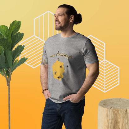Man wearing a gray t-shirt with a graphic design of a bee and the words 'Bee Yourself' on a yellow background