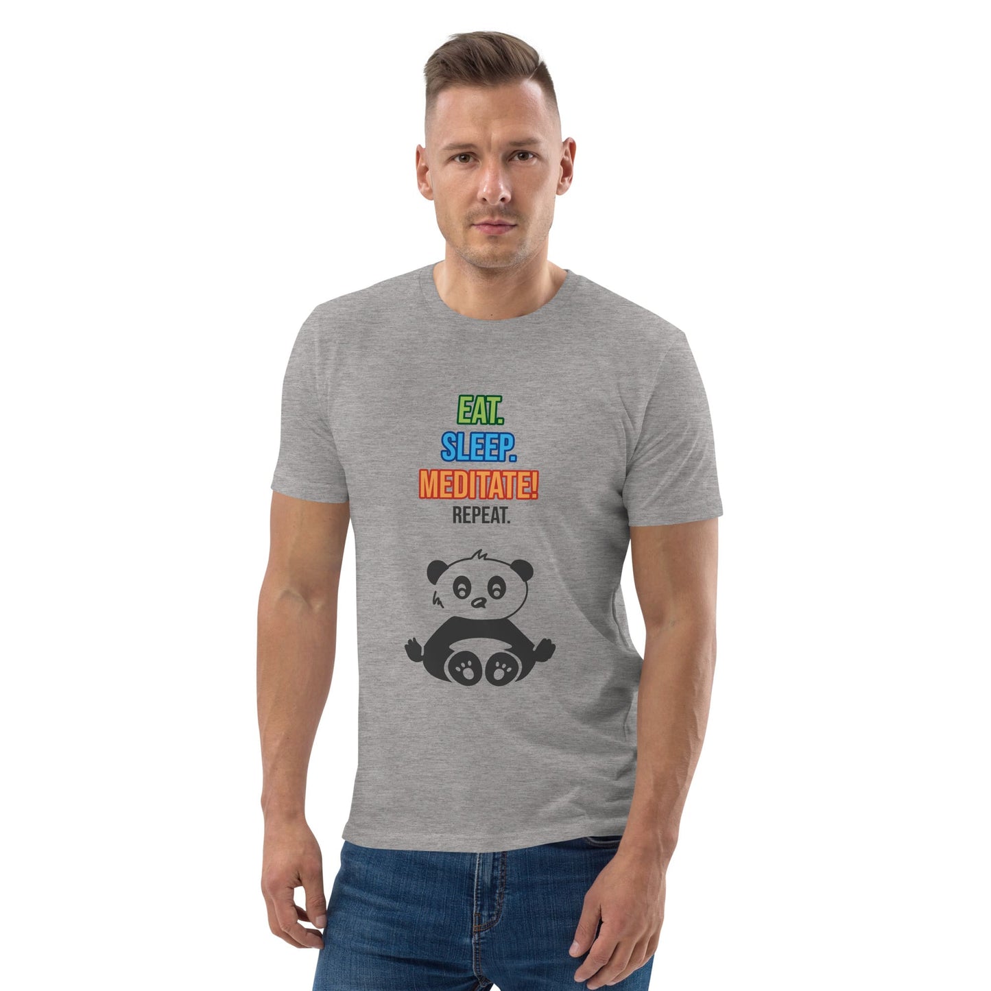 A man wearing a heather grey organic cotton t-shirt with colorful text that reads “EAT. SLEEP. MEDITATE! REPEAT.” above a cartoon panda sitting in a lotus position.