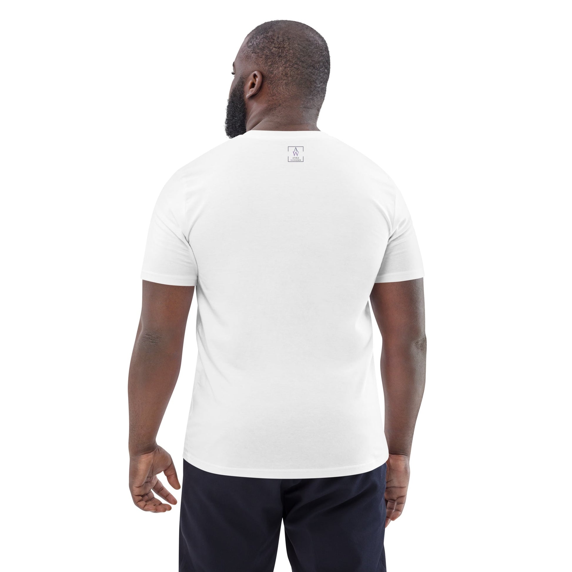 Back view of man wearing organic cotton white t-shirt showing minimal Anke Wonder branding and clean design.