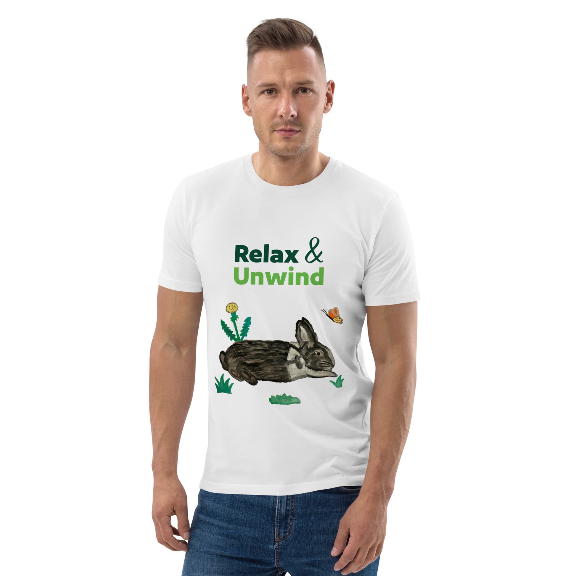 Man wearing white organic cotton t-shirt with hand-painted black-and-white rabbit, butterfly, and greens. Text reads: Relax & Unwind.