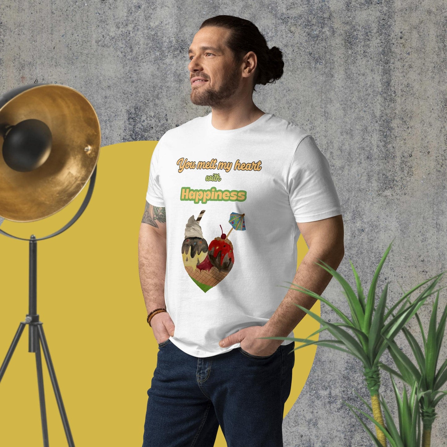 Side-angled view of man wearing white organic cotton t-shirt with illustrated ice cream cone heart and uplifting quote, showcasing fit and print placement.