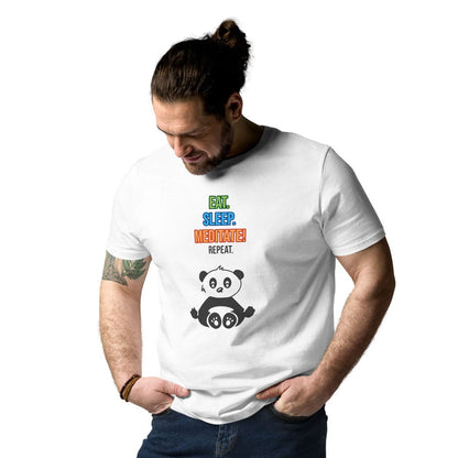 Man wearing a desert dust t-shirt with colorful "Eat. Sleep. Meditate! Repeat." panda design, front view at slight angle, tucked into jeans.