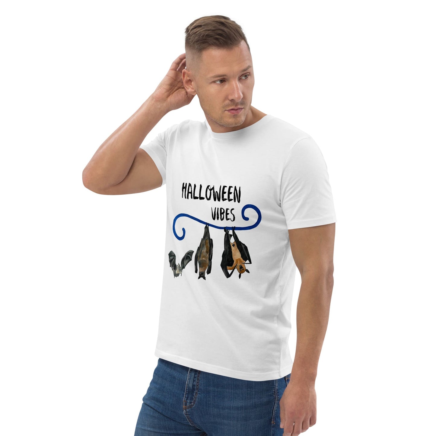 Man wearing a white t-shirt with 'Halloween Vibes' and bat illustrations on a white background