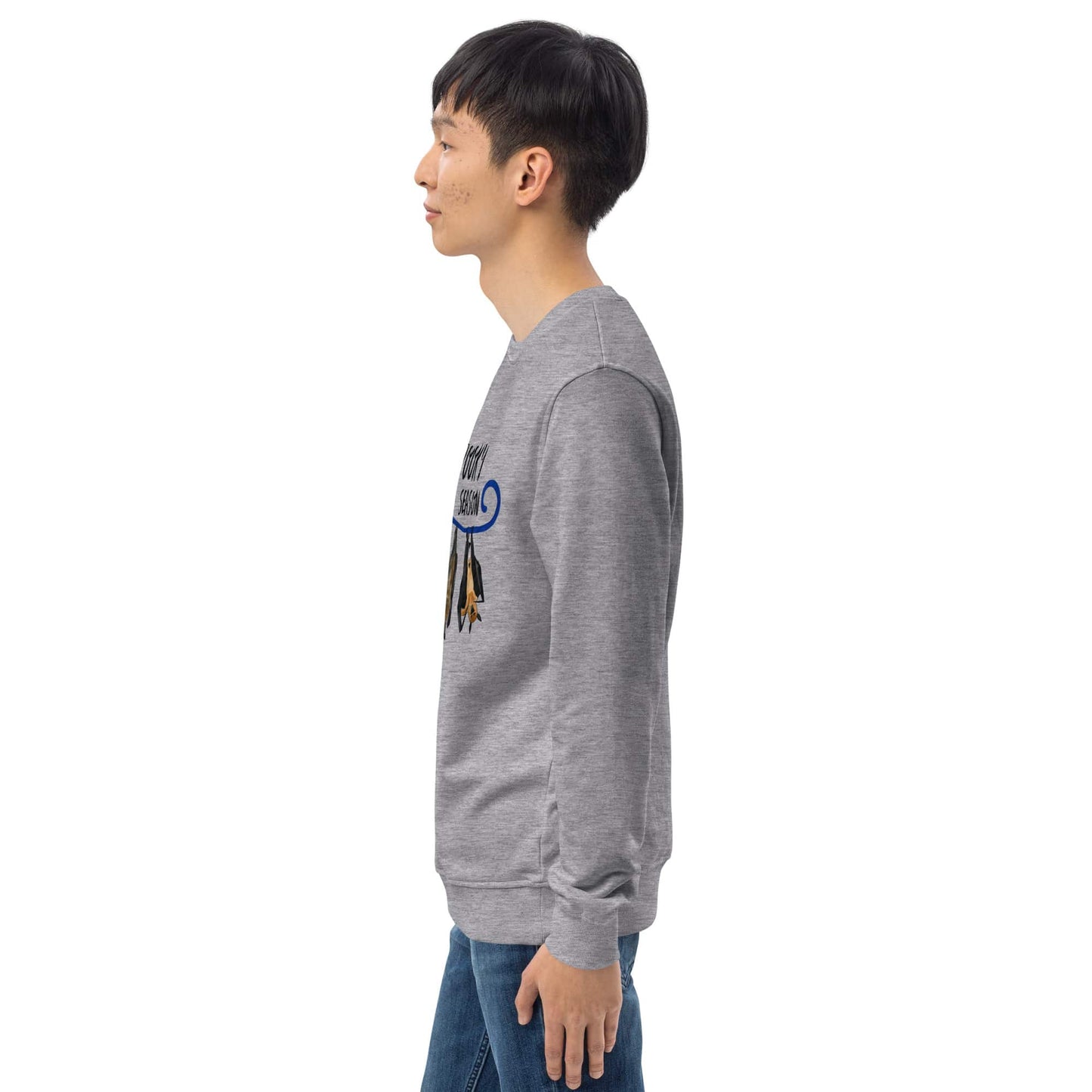 Side view of a man wearing a gray long-sleeve shirt with a halloween graphic design on the sleeve against a white background