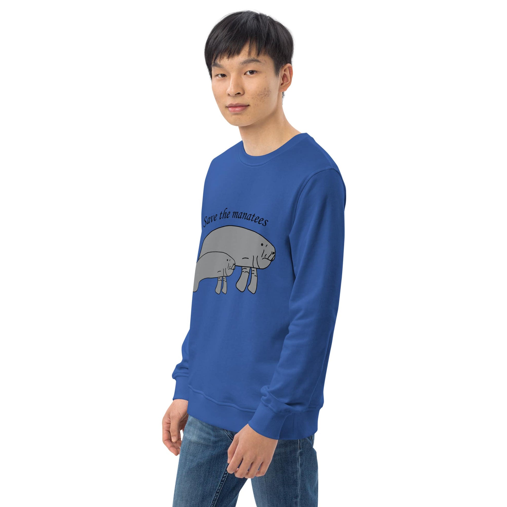 A model wears a blue 'Save the Manatees' sweatshirt, with the vibrant manatee design prominently displayed.