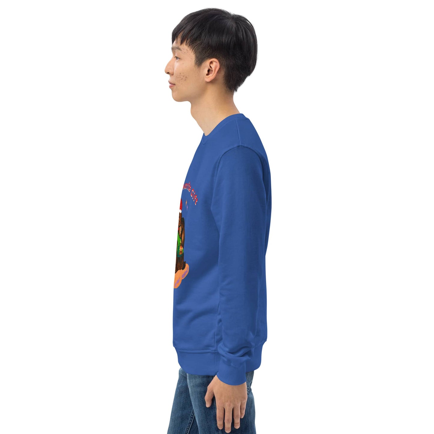 Side of man wearing a blue sweatshirt with a colorful christmas graphic on the back, standing against a white background