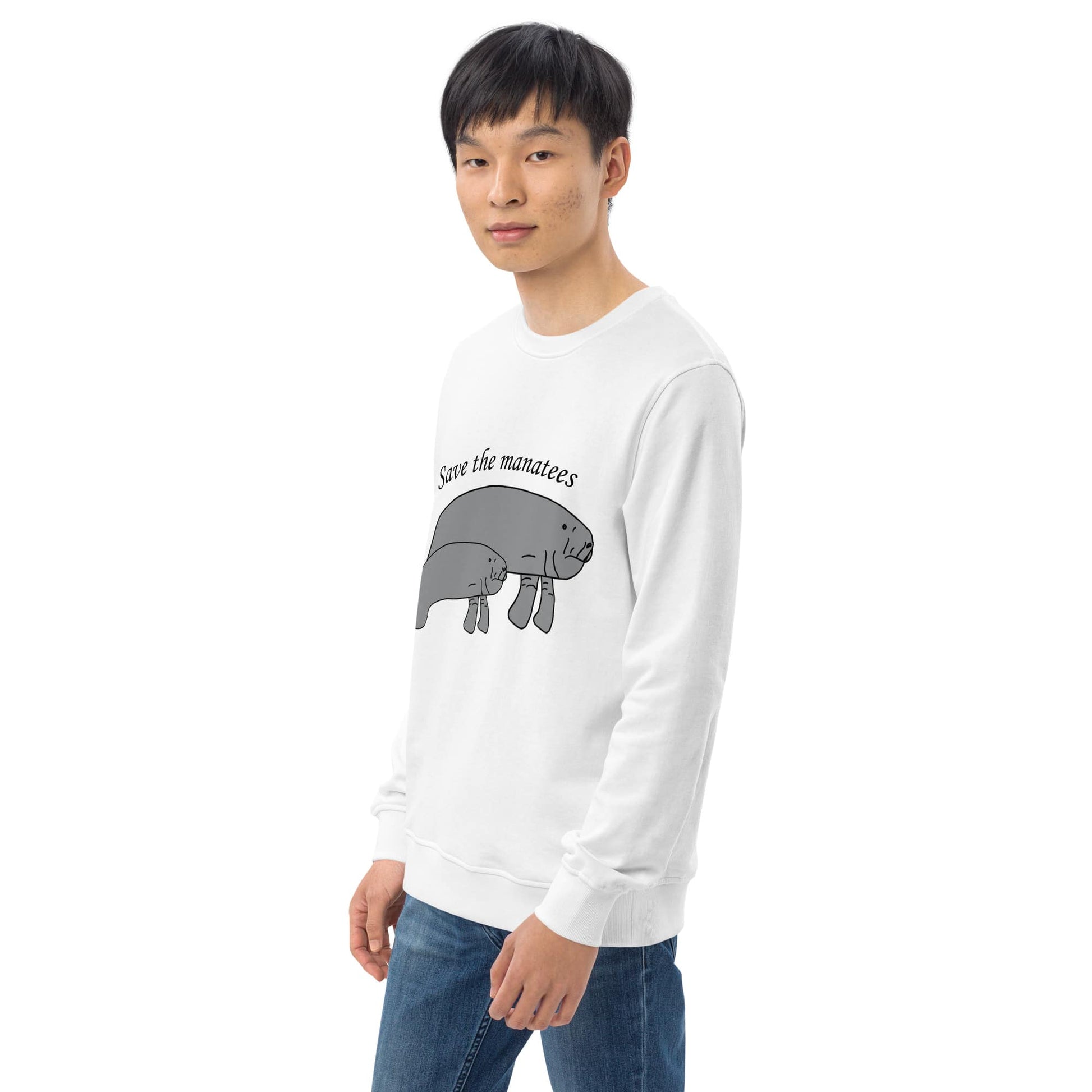 A partial front-left view of the white sweatshirt, featuring the manatee design and the Anke Wonder label discreetly on the hem.