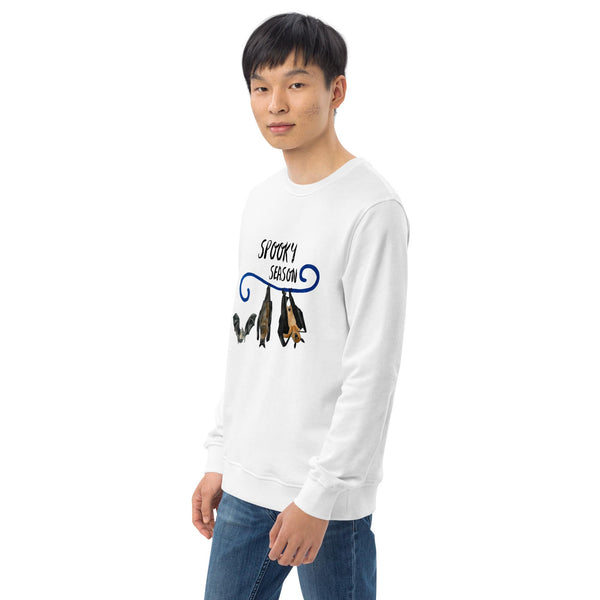 Man wearing a white long-sleeve shirt with a bat graphic design on a white background