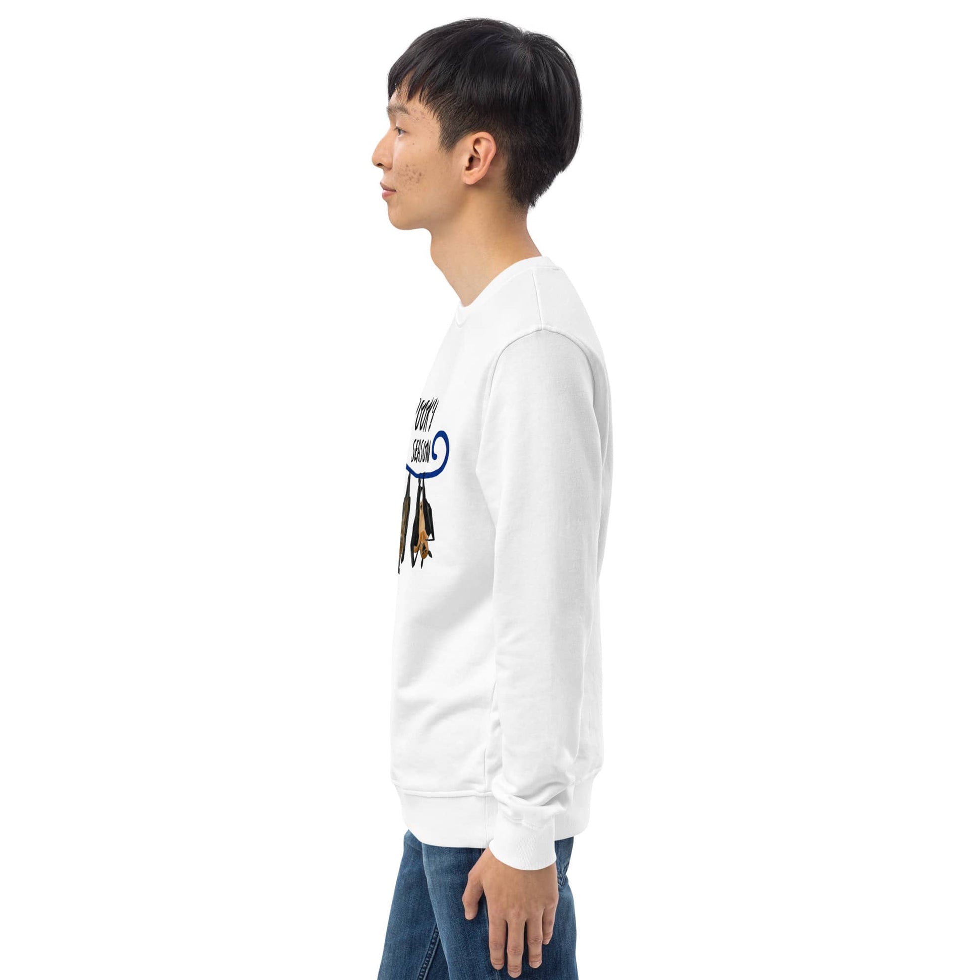 Side view of man wearing a white sweatshirt with a graphic design on the sleeve against a white background