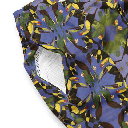 Close-up of mesh side pocket of men swim trunks with a colorful bird painting print.