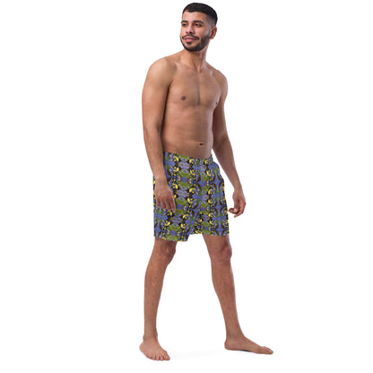 Man wearing recycled polyester swim trunks with a tropical bird print, front right view.