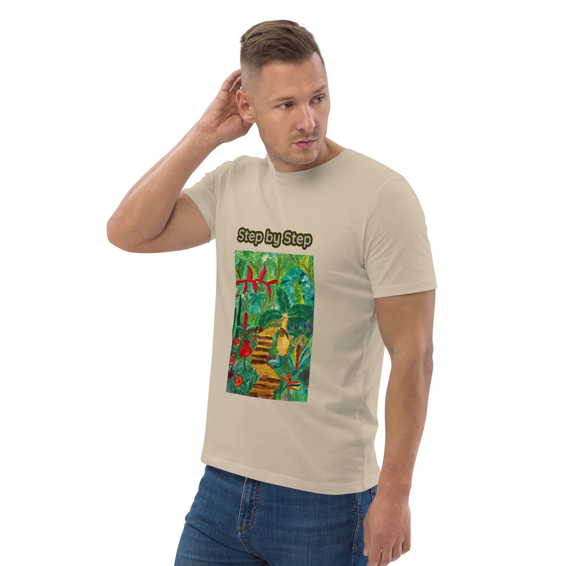 Man wearing a beige t-shirt with a colorful tropical artwork and 'Step by Step' text on a white background